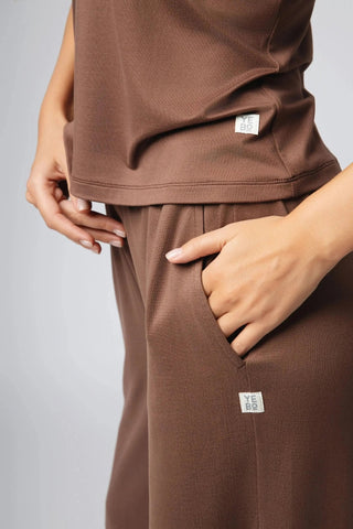 A casual outfit featuring the Addison Sweatpant by Yebo Clothing, emphasizing its role in conscious fashion as part of eco-friendly gym wear and performance hoodies.