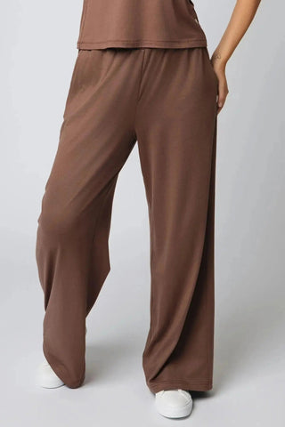 Yebo Clothing Addison Sweatpant displayed in a natural setting, highlighting its carbon neutral clothing principles and functionality as breathable workout gear.