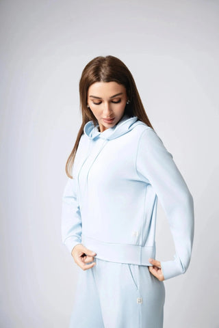 Harper Hoodie from Yebo Clothing, showcasing a cropped fit with adjustable drawstrings, perfect for an active lifestyle, combining sustainable materials for performance and comfort.