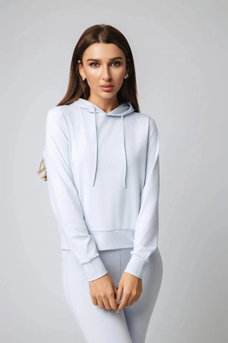 Harper Hoodie by Yebo Clothing, a sustainable performance activewear piece made from recycled materials, featuring a cropped fit and adjustable drawstrings, perfect for mindful movement and layering as breathable workout gear or minimalist loungewear.