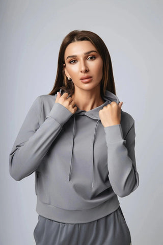 Harper Hoodie styled with yoga leggings, demonstrating Yebo Clothing's commitment to sustainable performance activewear and ethical fitness apparel, ideal for both lounging and high-energy workouts.