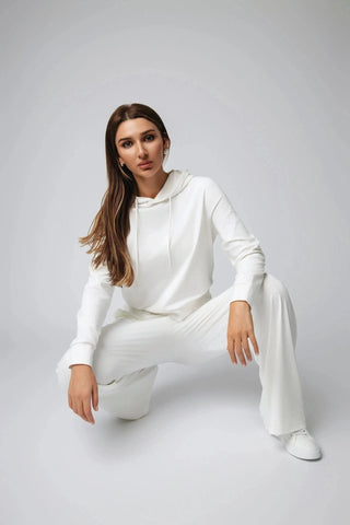 The Harper Hoodie by Yebo Clothing showcases its eco-friendly design, featuring moisture-wicking fabric that makes it ideal for performance while embracing conscious fashion in sustainable athleisure.