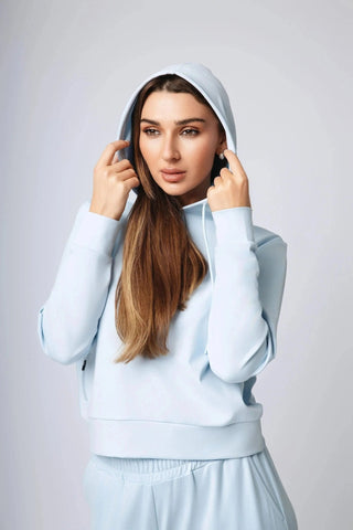 Yebo Clothing's Harper Hoodie, an ethical fitness apparel piece made from recycled polyester, designed for comfort and style, suitable for minimal loungewear and sustainable athleisure.