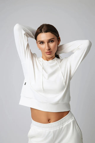 Back view of the Harper Hoodie by Yebo Clothing highlighting its slightly cropped fit and recycled materials. This stylish hoodie merges comfort with performance in the eco-friendly gym clothes category.