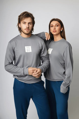 A stylish model wearing the I See You Limited Edition Sweatshirt from Yebo Clothing, showcasing sustainable performance activewear made from recycled materials. This eco-friendly gym clothes choice embodies ethical fitness apparel and mindful movement, perfect for breathable workout gear. Ideal for both casual outings and workouts, this carbon neutral clothing option reflects the I See You movement, making it a must-have in sustainable athleisure.