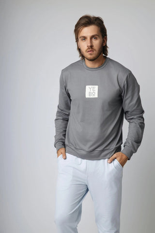 Model wearing the I See You Limited Edition Sweatshirt by Yebo Clothing, an example of performance hoodies crafted from recycled polyester that supports carbon neutral clothing initiatives in sustainable fashion.