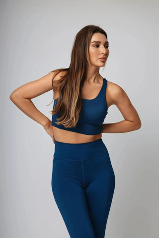 Elevate your athletic wardrobe with Yebo Clothing's Jordan Sports Bra, featuring light padding for comfort and designed from ethical fitness apparel materials like sustainable athleisure.