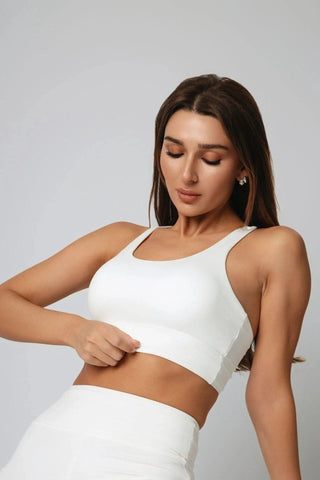 Experience the Jordan Sports Bra by Yebo Clothing, featuring a V-back design and adjustable straps, made from breathable workout gear crafted using moisture-wicking fabric to support mindful movement.