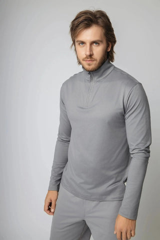 The Lucas Quarter Zip by Yebo Clothing showcases a sleek design perfect for mindful movement, featuring sustainable performance activewear made from eco-friendly materials. Ideal for both the boardroom and gym, this piece captures the essence of conscious fashion with breathable workout gear.