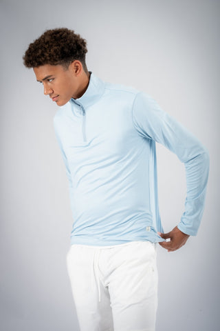 A dynamic shot of a model wearing the Lucas Quarter Zip from Yebo Clothing, representing carbon neutral clothing crafted for both performance and style.