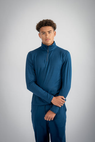 Close-up shot of the eco-friendly fabric of the Lucas Quarter Zip, by Yebo Clothing, highlighting moisture-wicking properties and its role in the I See You movement for sustainable athleisure.