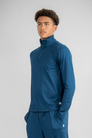 The defining piece for any conscious closet, the Lucas Quarter Zip by Yebo Clothing is perfect for yoga or jogger sessions. Crafted with recycled materials, it exemplifies eco-friendly gym clothes with a luxury touch and thoughtful consideration for the planet.