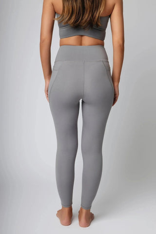 Maha Legging by Yebo Clothing, featuring buttery soft, moisture-wicking fabric for ultimate comfort during workouts, designed as eco-friendly gym clothes using recycled materials. The sustainable performance activewear is perfect for mindful movement and features sleek side pockets for convenience.
