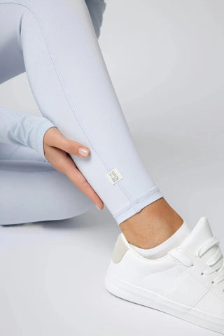 Lifestyle shot of Maha Legging by Yebo Clothing in an outdoor setting, ideal for both workouts and casual wear with features that support sustainable performance and carbon neutral clothing.