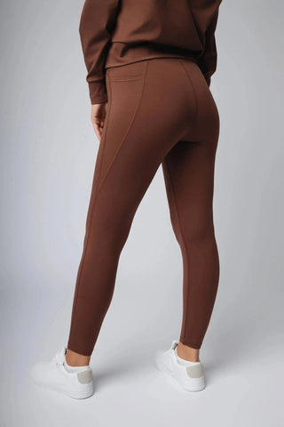 A close-up of the Maha Legging by Yebo Clothing, featuring high waist styling and side pockets, crafted from moisture-wicking fabric for a breathable experience in eco-friendly gym clothes.