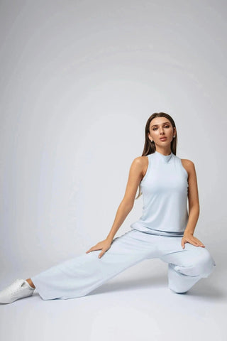 Sophie Tank Top displayed on a model, reflecting a perfect blend of sporty and elegant style, crafted with moisture-wicking fabric for a carbon neutral clothing choice.