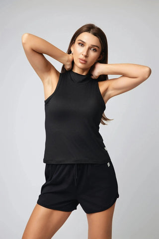 Sophie Tank Top by Yebo Clothing demonstrated in an active setting, representing sustainable performance activewear and mindful movement through its elegant ease.
