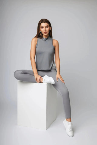 Sophie Tank Top by Yebo Clothing, a stylish piece of sustainable performance activewear made from recycled materials, offers a breathable workout experience with moisture-wicking fabric for mindful movement.