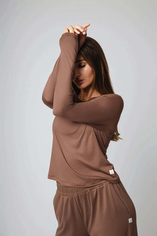 The Valentina Ballerina Shirt from Yebo Clothing shown in a studio setup, capturing the essence of comfort and style in breathable workout gear that supports the I See You movement with its carbon neutral clothing approach.