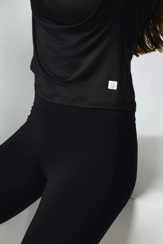 The Valentina Ballerina Shirt from Yebo Clothing is a lightweight layering piece made from recycled materials, highlighting the brand’s commitment to sustainable fashion. This breathable workout gear is perfect for those who enjoy mindful movement, serving as a versatile piece in your sustainable athleisure wardrobe.