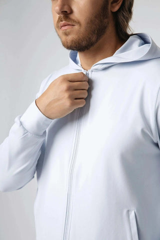 Lifestyle shot of the Zahaan Hoodie from Yebo Clothing in an outdoor setting, emphasizing its role in comfortable yoga leggings and mens joggers, crafted from recycled polyester for sustainable clothing.