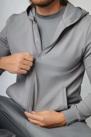 The Zahaan Hoodie showcases an adjustable warm hood and convenient zip-up design by Yebo Clothing. This ethical fitness apparel is perfect for those who prioritize sustainable activewear made with recycled materials and mindful fashion choices.